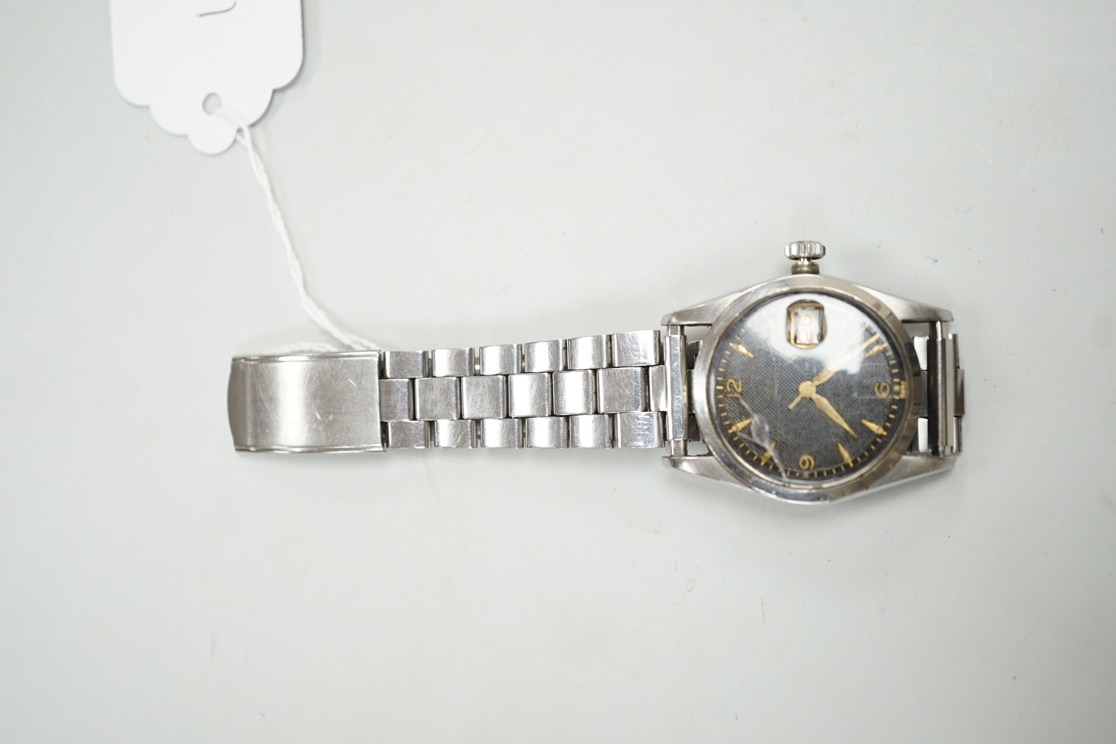 A gentleman's late 1950's? stainless steel Tudor Oysterdate manual wind wrist watch with black honeycomb dial, on associated stainless steel bracelet, case diameter 34mm, the case back numbered 7929 over 204837, no box o